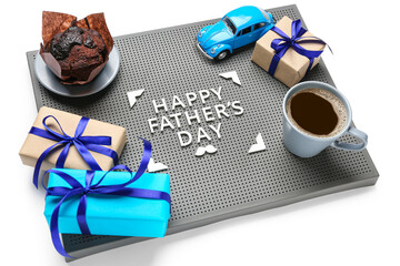 Board with text HAPPY FATHER'S DAY, gifts, toy car, muffin and cup of coffee on white background