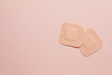Contraceptive patches on pink background, flat lay. Space for text