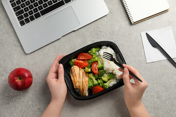 Office employee having business lunch at workplace, top view