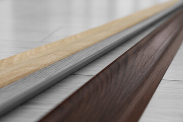 Different plinths on laminated floor in room