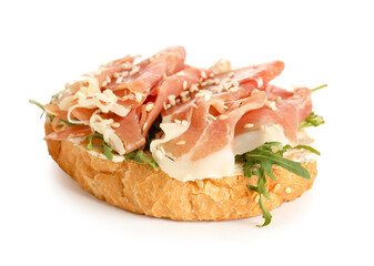 Tasty bruschetta with ham isolated on white background