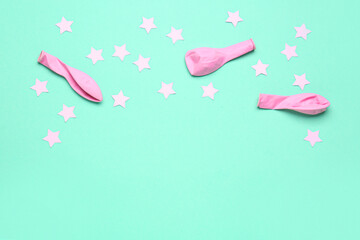 Composition with pink balloons, stars and serpentine on blue background
