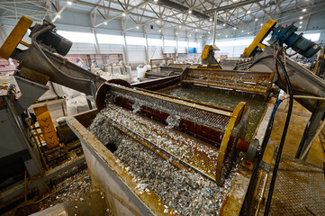 Automatic shredded plastic washing machine. Washing in a bath of water using special paddle mixers.