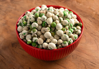 A Bowl of Green Wasabi Peas on a Table