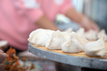The prepared dumplings are neatly placed on the tray
