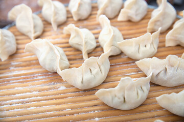 Wrapped uncooked white flour dumplings