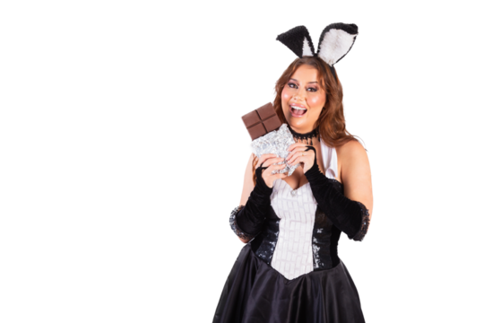Beautiful Brazilian woman, with rabbit clothes, Easter. holding Cocholate bar. Easter photo.