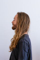 Blond long hair white man wearing black t shirt on white background