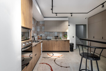 Beautiful spacious kitchen, for guests of a family hotel, with all necessary appliances