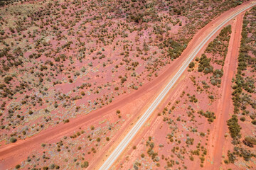 Looking down at red dirt roads going different directions in outback Australia
