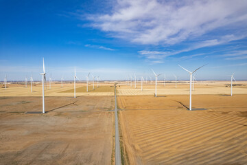 The expanse of wind turbines in a remote wind farm.