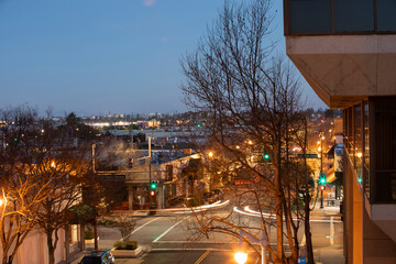 Night time view of traffic streaming through downtown San Carlos, California.
