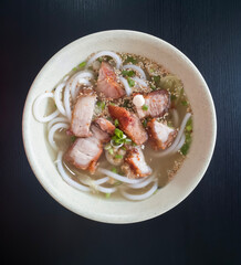 Crispy pork noodles. Hainanese-style rice noodles with crispy pork.