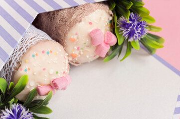 Cupcakes and cakes lie beautifully in a box. A postcard for Easter. Space for text. Close-up. Selective focus