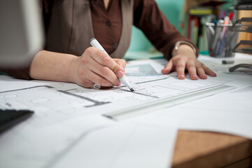 Architect at her working desk. Working on new projects. Architecture and design