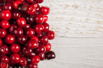 Cherries on white wooden table. Copyspace for your text is available