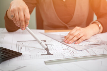 Details shot of architect blueprints on a desk. Business and creativity. Architecture job