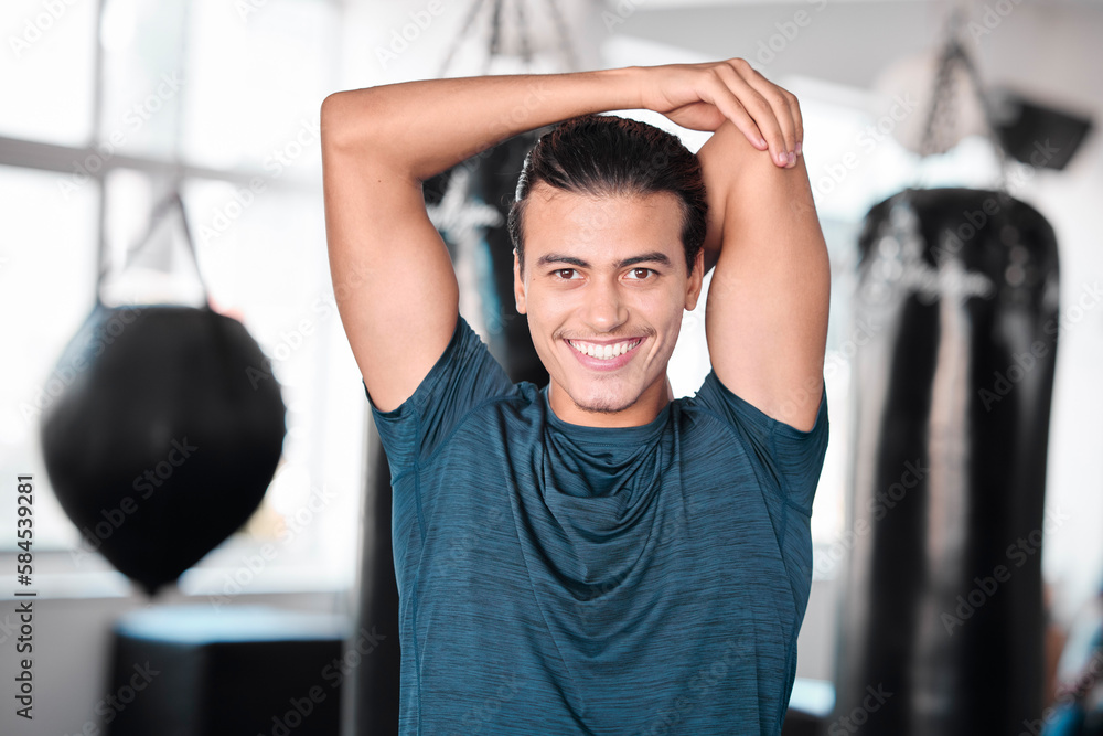 Wall mural Portrait, stretching arm and man in gym ready to start workout, training or exercise. Sports smile, health fitness and happy male athlete warm up, stretch or prepare for exercising for flexibility.