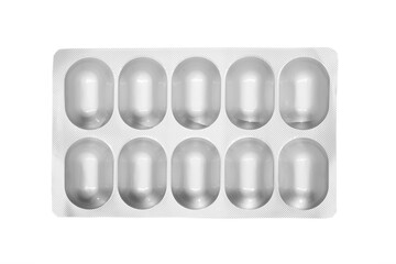 Macro shot pile of tablets pill in silver blister packaging isolated on white background. Aluminium...