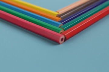 Colored Pencils on Blue Background