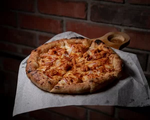 Foto op Plexiglas Delicious American chicken pizza with bbq on a wooden board. © Emmanuel