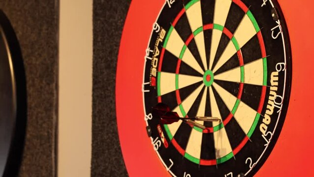 Close up shot of a game of darts throwing at the triple 17 seventeen.