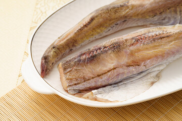 Fresh sashimi in a white porcelain dish