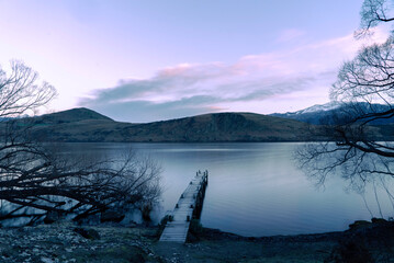 New Zealand landscape of a lake with a wharf near Queenstown