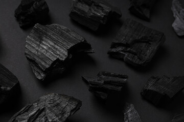 Natural wood or hardwood charcoal on black background