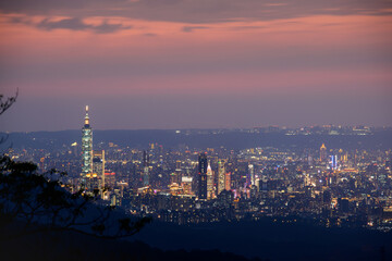 Dynamic Clouds and Urban Scenery: A image of Taipei's Evening Sky Mesmerizing Taipei Twilight: Orange Skies and Illuminated Cityscape