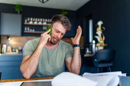 A Manager Who Works From Home Has A Tense Phone Conversation Because A Mistake Was Made At The Office