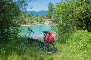 folding bike beside turquoise Isar river, route from Bad Tolz to Lenggries