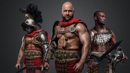 Fototapeta na wymiar Portrait of muscular greek soldiers fromt past with armor and cold steel.