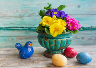 Easter still life with primula flowers and easter eggs