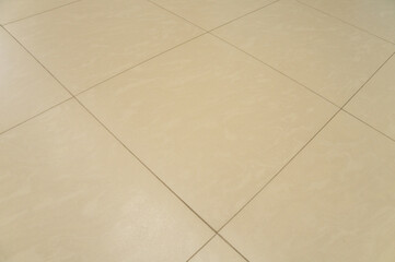 New beautiful sandstone texture background of ceramic wall and floor tiles in perspective.