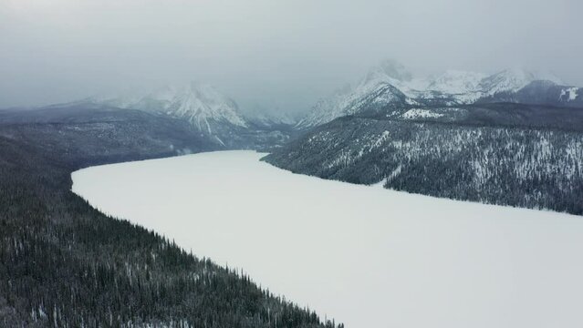 Aerial over frozen Redfish Lake in Sawtooth National Forest; Stanley Idaho