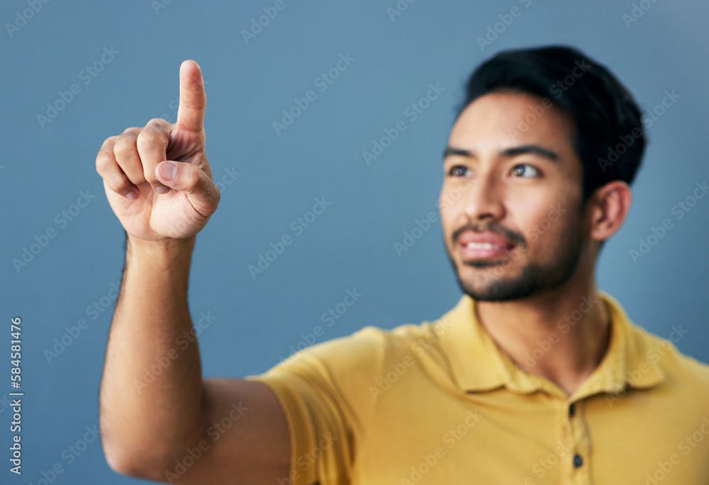 Poster finger, pointing and asian man with invisible hologram in studio with mockup against blue background