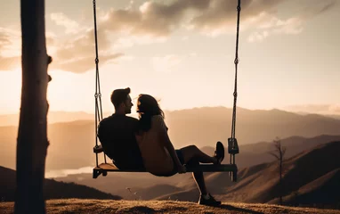Poster Happy couple sitting on a swing overlooking a beautiful landscape with mountains and valleys in soft evening light at sunset. Illustrative Generative Ai. Not real people. © henjon