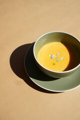 Pumpkin soup puree, close-up. Soup in bowl