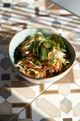 Fresh vegetable salad with sliced cauliflower spinach leaves