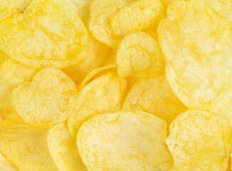 Crispy potato chips texture or background. Close up