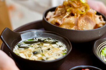 Miso soup, silken tofu, wakame seaweed, spring onion.