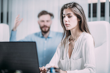 Mobbing at Work. Scared Female Employee in the Modern Office