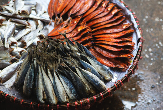 a basket of dried fish at a market in Thailand