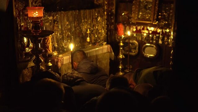Orthodox worshipers during a Christmas mass in monastery ini Mount Athos, Greece