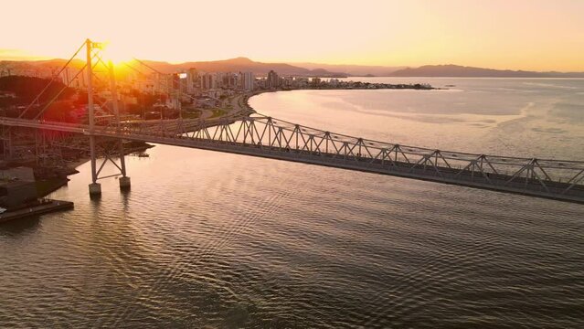 Hercilio luz cable bridge with warm sunset light in Florianopolis, Brazil. Aerial view