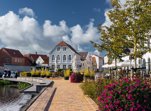 Cityscape of T&oslash;nder, Southern Denmark (Syddanmark). Lake near the old town with flowers around it.