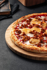 Closeup on pizza with cheddar cheese and minced beef