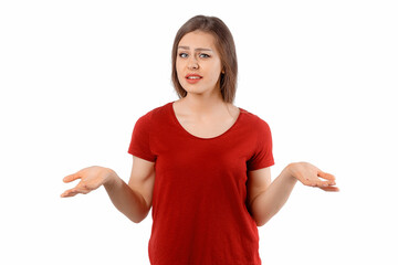 Portrait of confused and questioned unaware funny brunette woman shrugging with puzzled look and hands raised sideways, having no idea, standing without answer over white studio background