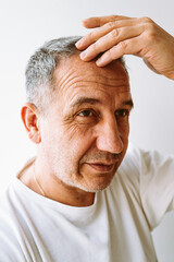 Portrait senior man with grey hair and white t-shirt